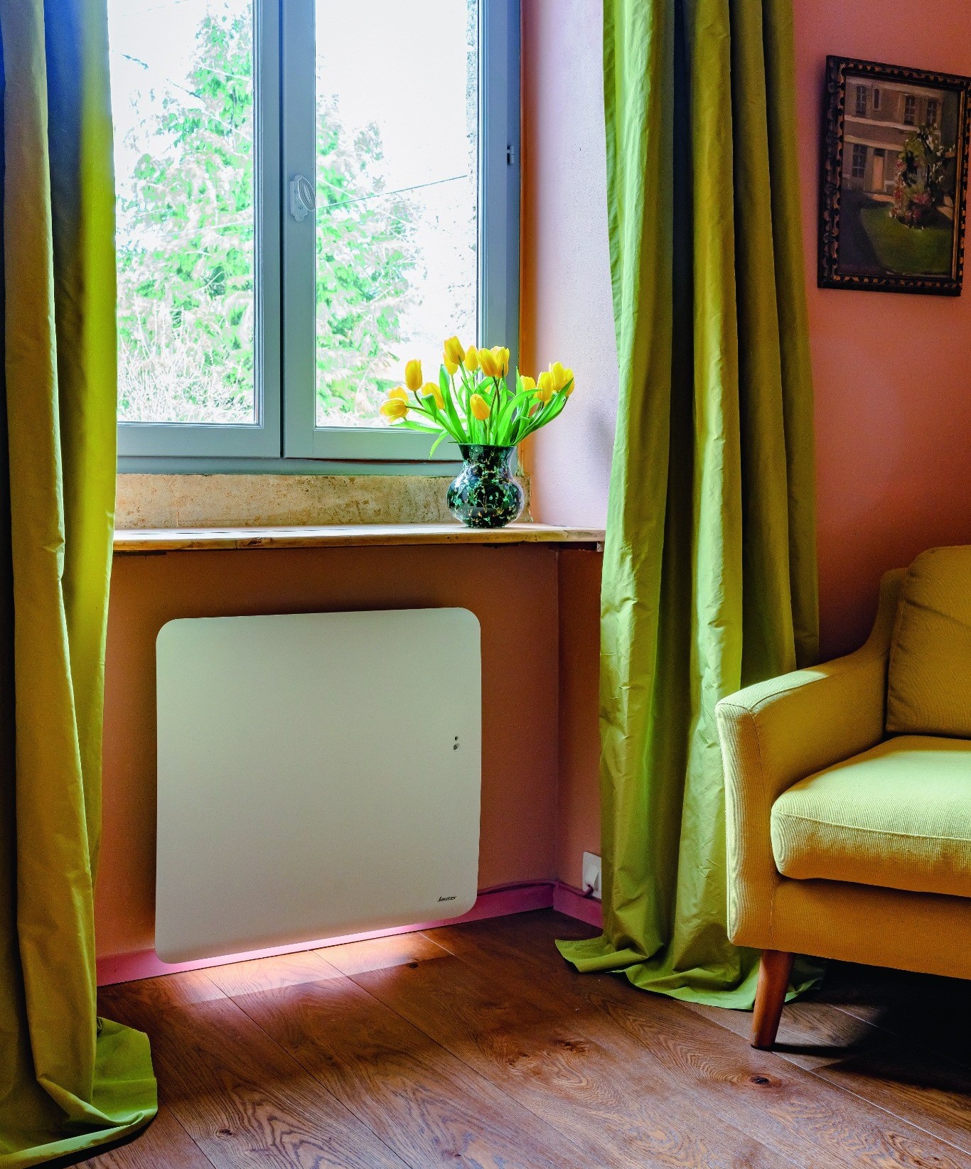 radiateur électrique placé sous une fenêtre pour diffusion optimale de la chaleur