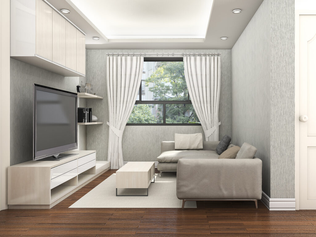 Petit salon lumineux avec canapé beige, mobilier clair et décoration minimaliste