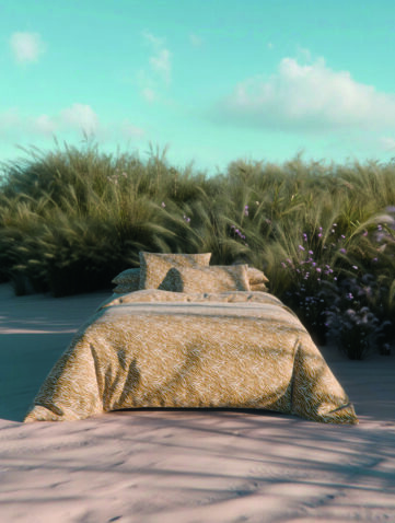 linge de lit aux tons naturels dans une ambiance estivale et sauvage