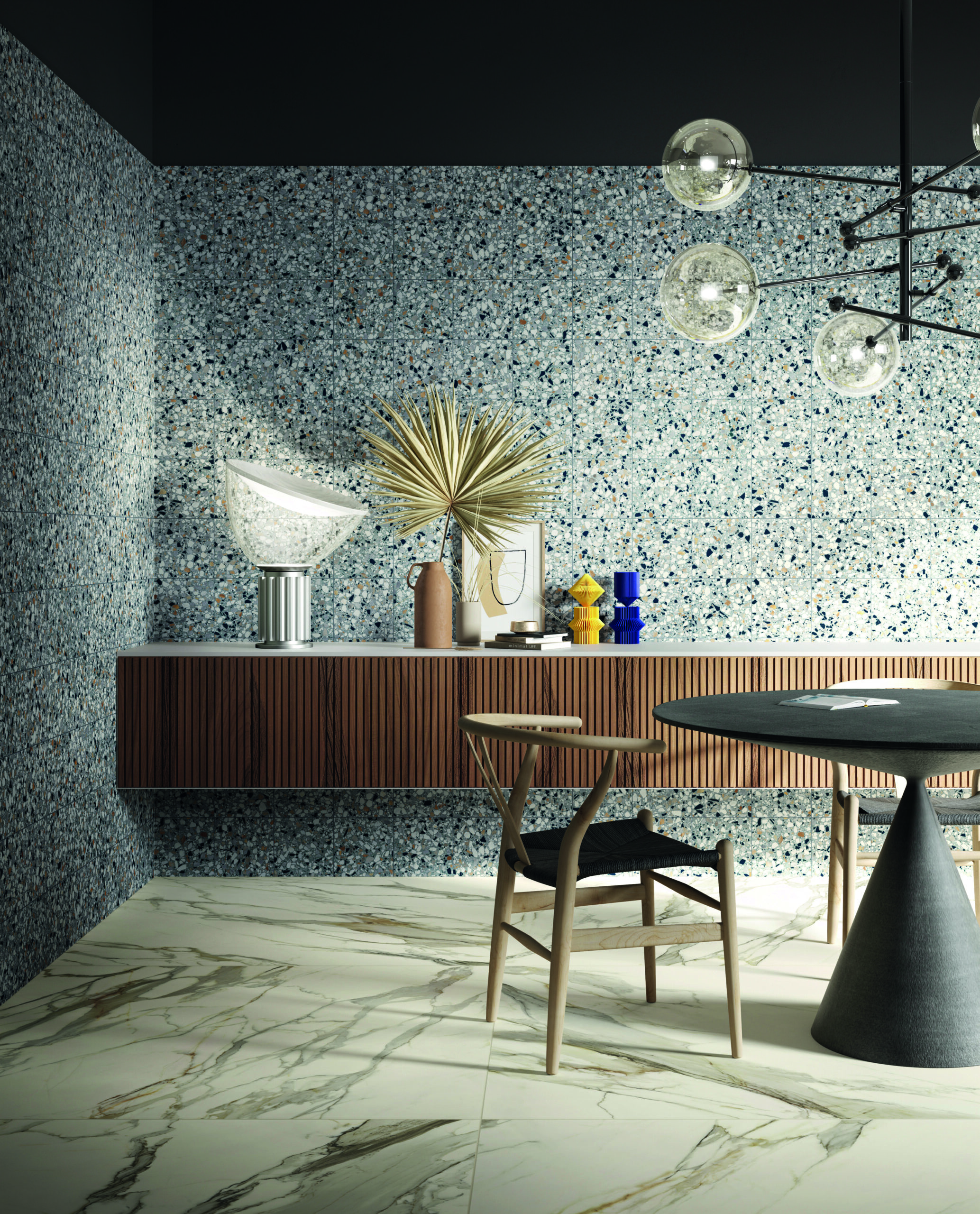 Salle à manger contemporaine avec mur en carrelage effet terrazzo et mobilier design