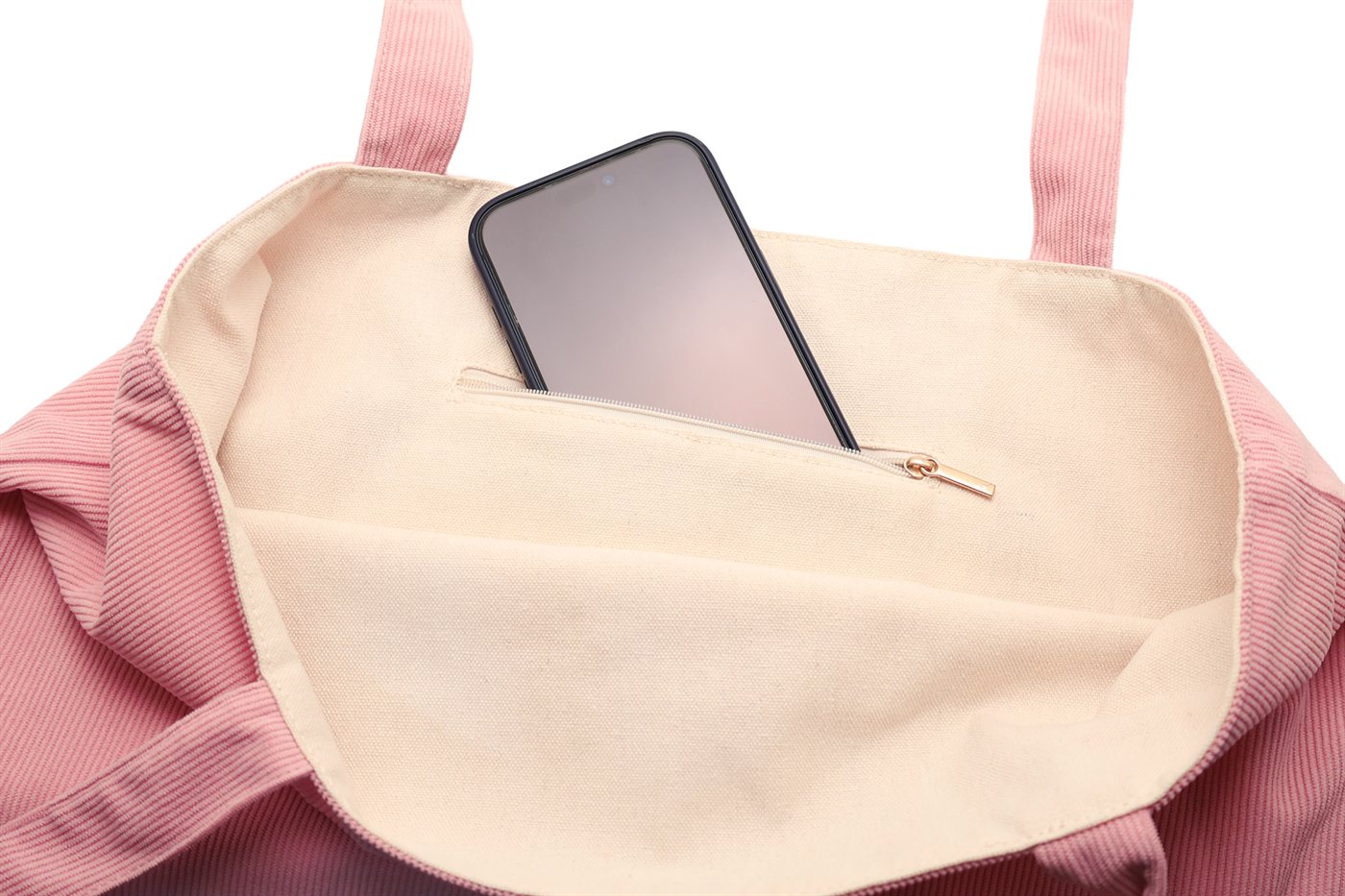 Intérieur du tote bag rose Akinod avec smartphone rangé dans la poche zippée